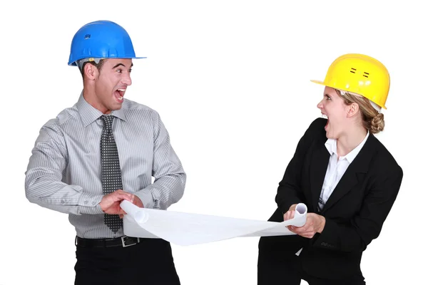 Two architects fighting over plans — Stock Photo, Image