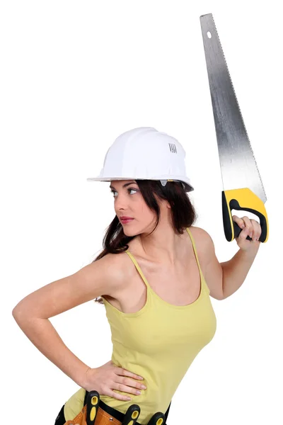 Artesana sexy sosteniendo una sierra manual —  Fotos de Stock