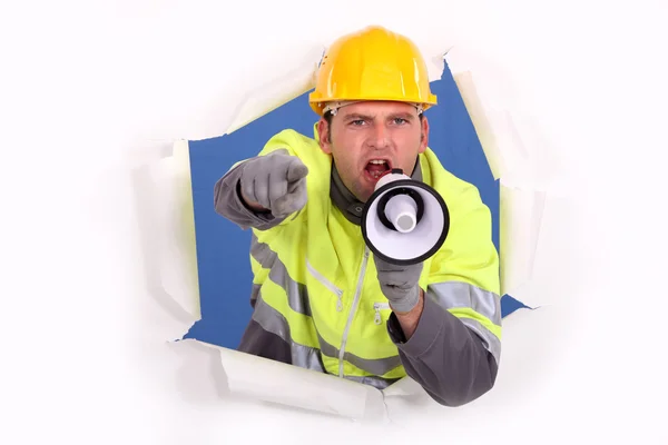 Builder shouting through megaphone — Stock Photo, Image