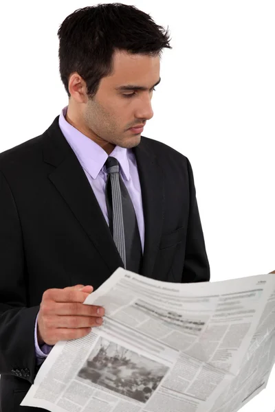 Businessman reading a newspaper — Stock Photo, Image