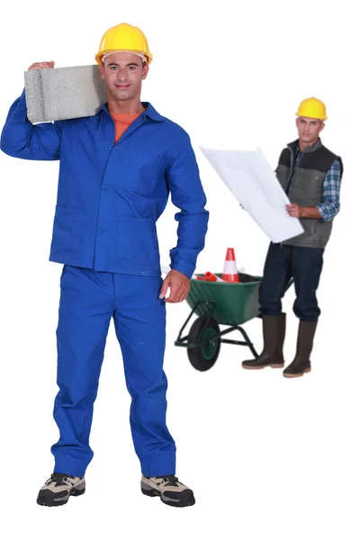 Man carrying a cement block — Stock Photo, Image