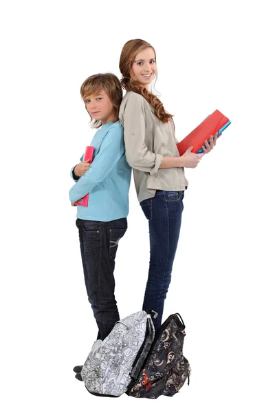 Brother and sister with homework Stock Picture