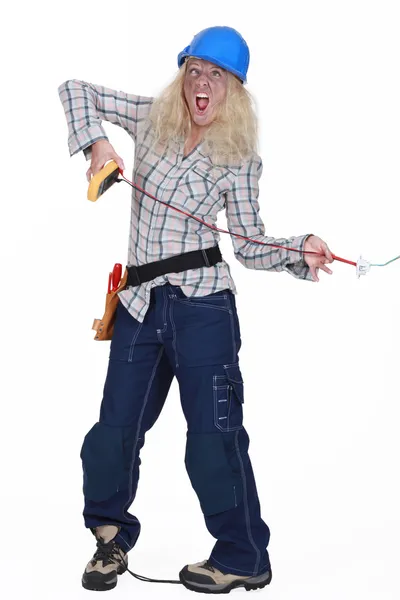 Female electrician getting a shock — Stock Photo, Image