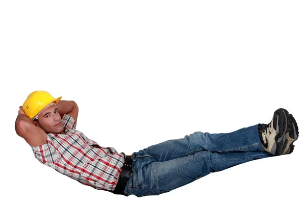 Arbeider doen sit ups, geïsoleerd op witte achtergrond — Stockfoto