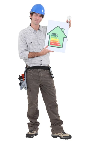 Constructor showing energy rating sign — Stock Photo, Image