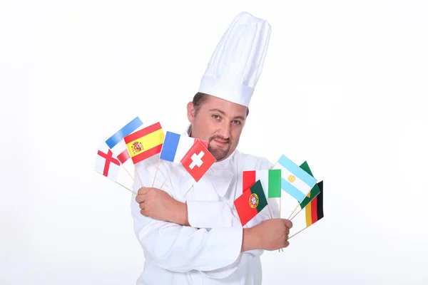 Chef sosteniendo banderas — Foto de Stock