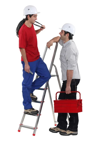 Two electricians having at chat at work — Stock Photo, Image