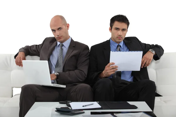 Businessmen working together in presentation Stock Photo