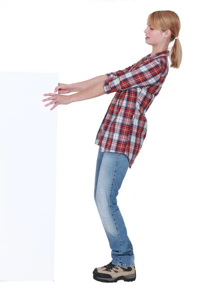 Female manual worker with poster — Stock Photo, Image