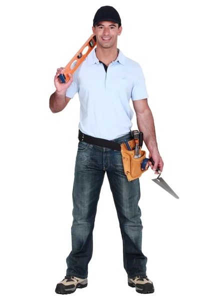 Portrait of handsome carpenter carrying ruler — Stock Photo, Image