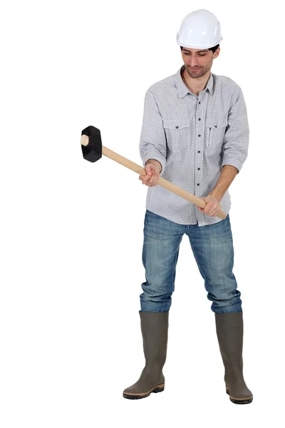 Tradesman holding a mallet — Stock Photo, Image