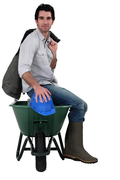 Worker with a wheelbarrow — Stock Photo, Image