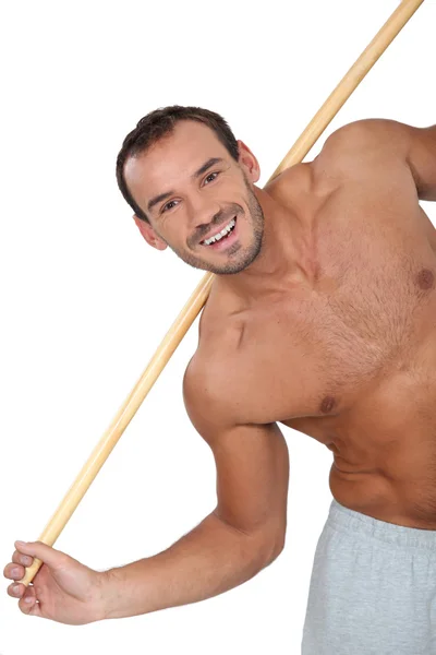 Hombre haciendo ejercicio en el gimnasio — Foto de Stock