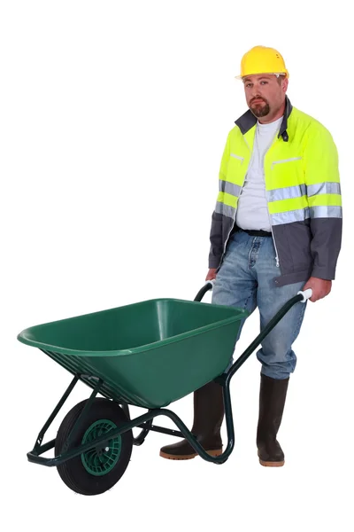 Mason stood with empty wheelbarrow — Stock Photo, Image