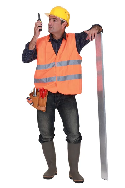 Foreman standing in studio using talkie walkie — Stock Photo, Image