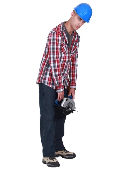 Homem segurando serra circular — Fotografia de Stock