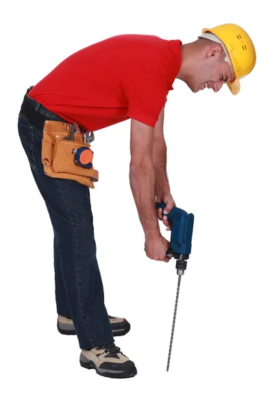 Man with a masonry drill — Stock Photo, Image