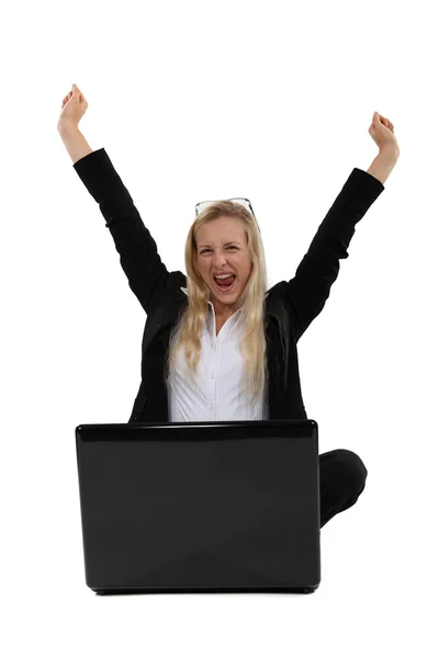 Ecstatic woman sat with laptop — Stock Photo, Image