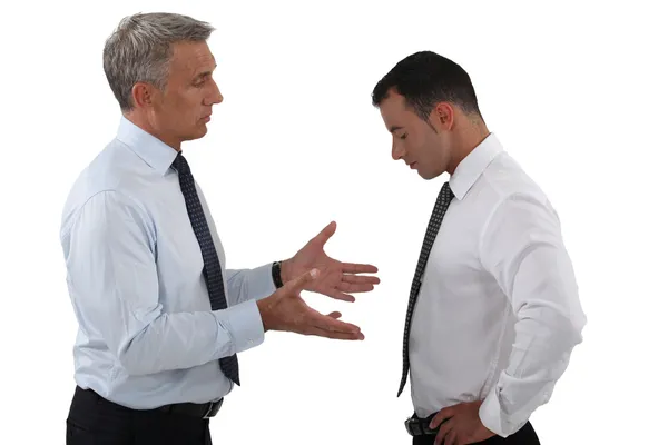 Jefe y empleado teniendo una discusión seria — Foto de Stock