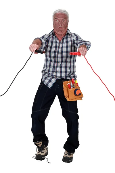 A shocked electrician. — Stock Photo, Image