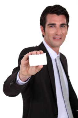Man holding up a blank business card clipart