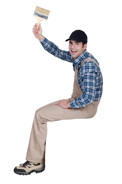 Happy painter holding brush — Stock Photo, Image