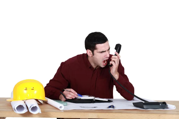 Architect shouting down the telephone — Stock Photo, Image