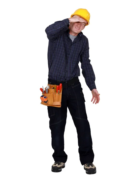 Tradesman being blinded by the light — Stock Photo, Image