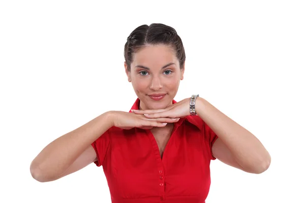 Young woman with her chin resting on her hands — Stock Photo, Image