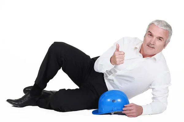 Man reclining on the floor — Stock Photo, Image