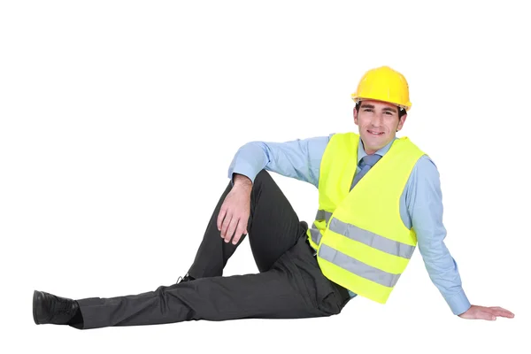 Ingenieur zittend op de grond — Stockfoto