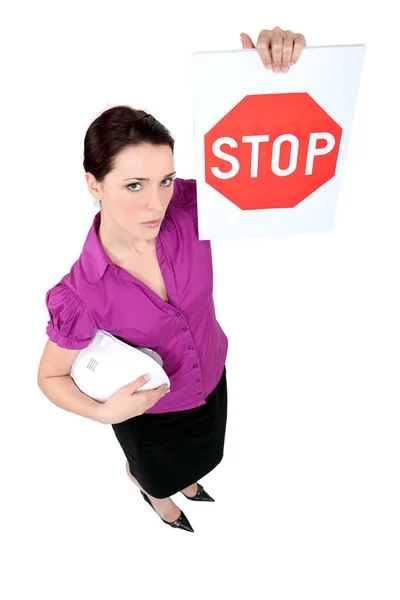 Businesswoman holding stop sign — Stock Photo, Image