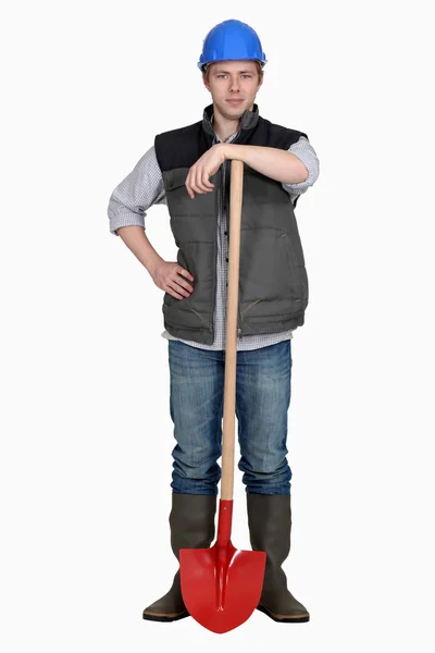 Builder stood with spade — Stock Photo, Image