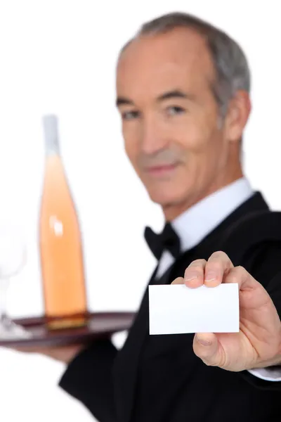 Wine steward showing a business card — Stock Photo, Image