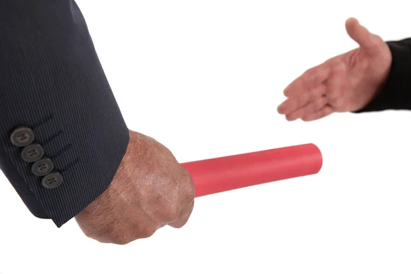 Businessman passing on a baton — Stock Photo, Image