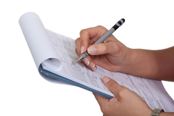 Woman filling a form — Stock Photo, Image