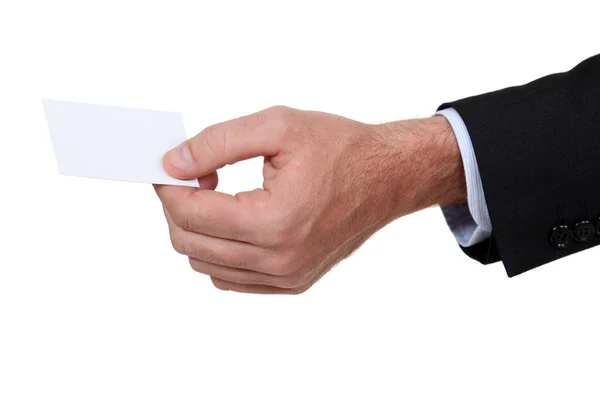 Male hand giving visit card — Stock Photo, Image