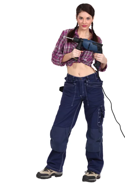 Woman with a powerdrill Stock Picture