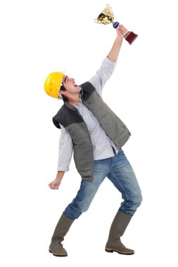 Tradesman holding a trophy clipart