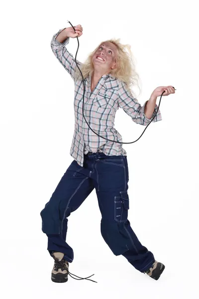 Woman being electrocuted — Stock Photo, Image