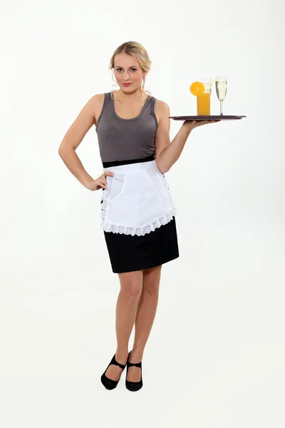 Waitress bringing drinks on a tray. — Stock Photo, Image