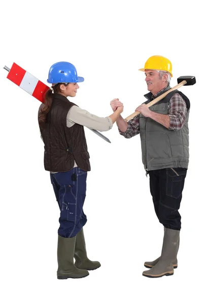 Apprentice and master shaking hands — Stock Photo, Image