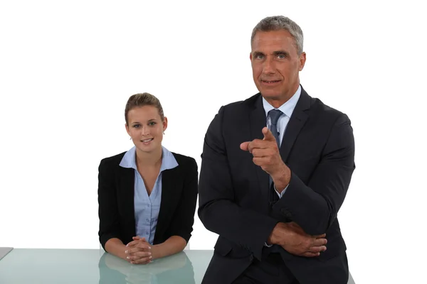 Senior businessman pointing at camera — Stock Photo, Image