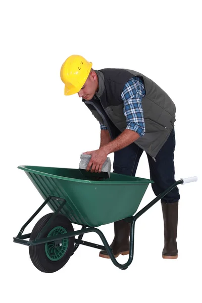 Builder with a wheelbarrow — Stock Photo, Image