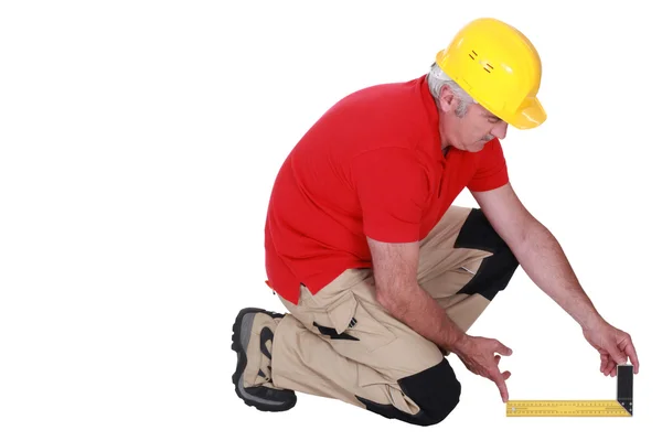 Middle-aged carpenter using set-square — Stock Photo, Image