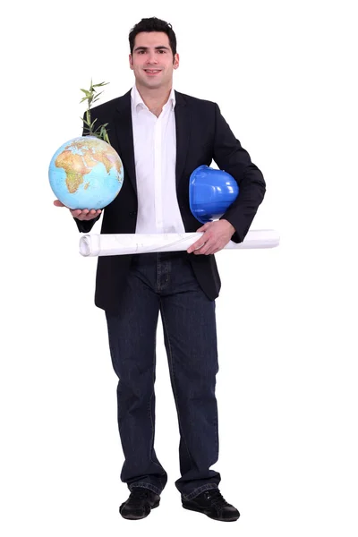 Architect with a plant growing out of a globe — Stock Photo, Image