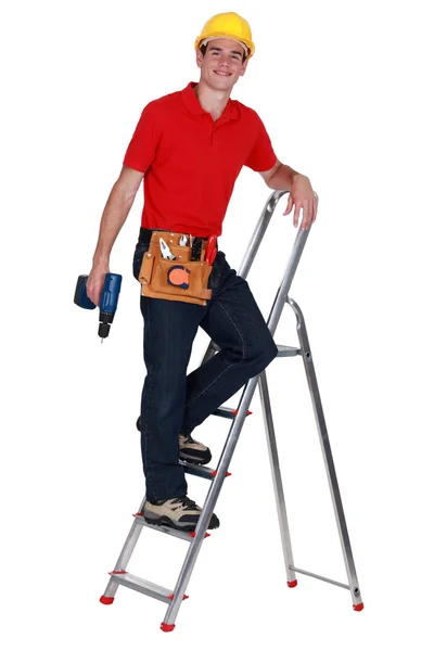 Reparador en una escalera — Foto de Stock