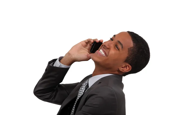 African businessman laughing on the phone — Stock Photo, Image