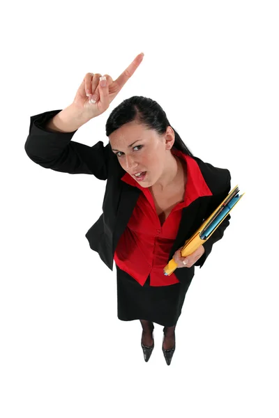 Businesswoman raising her hand — Stock Photo, Image