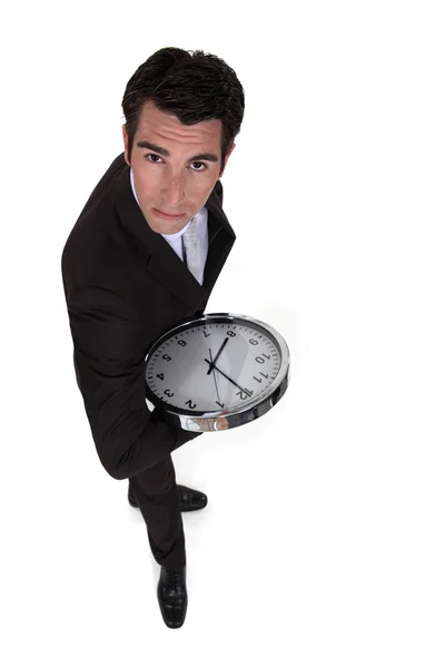Biznesmen gospodarstwa zegar — Zdjęcie stockowe